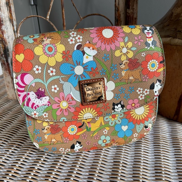 Dooney & Bourke Handbags - Dooney & Bourke Disney Pets floral crossbody bag saddlebag.